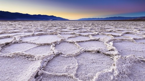 A unique salt flat andscape "Badwater basin" at Death Valley National Park in the evening